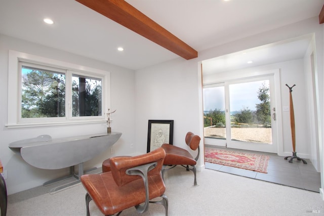 sitting room with light tile patterned flooring and beam ceiling