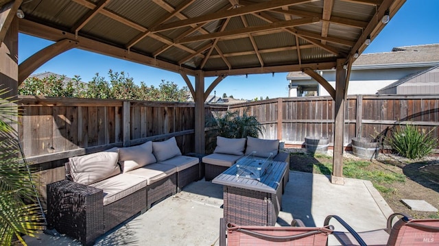 view of patio with a fenced backyard, a gazebo, and an outdoor living space