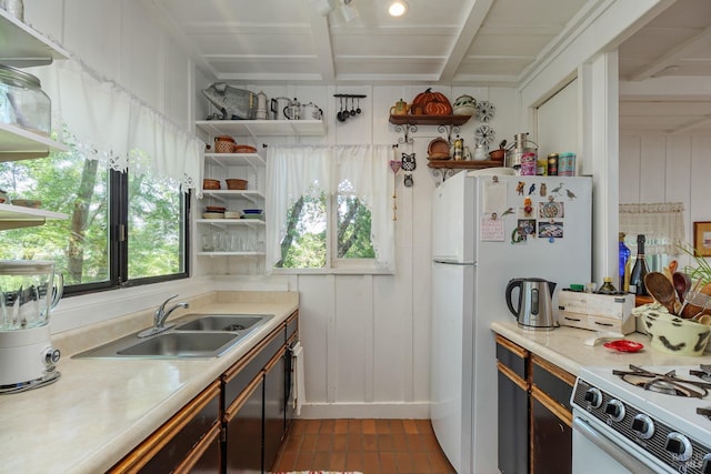 kitchen with sink and white appliances