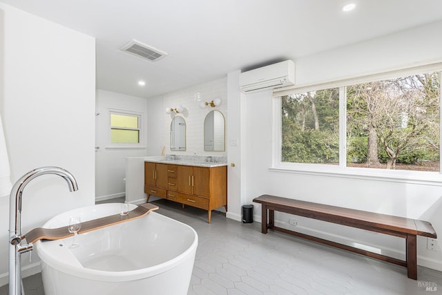 full bathroom featuring double vanity, visible vents, a soaking tub, an AC wall unit, and recessed lighting