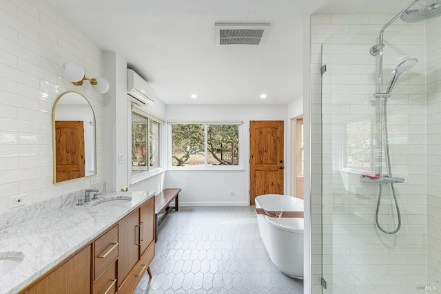 bathroom with a wall unit AC, a sink, visible vents, tiled shower, and double vanity