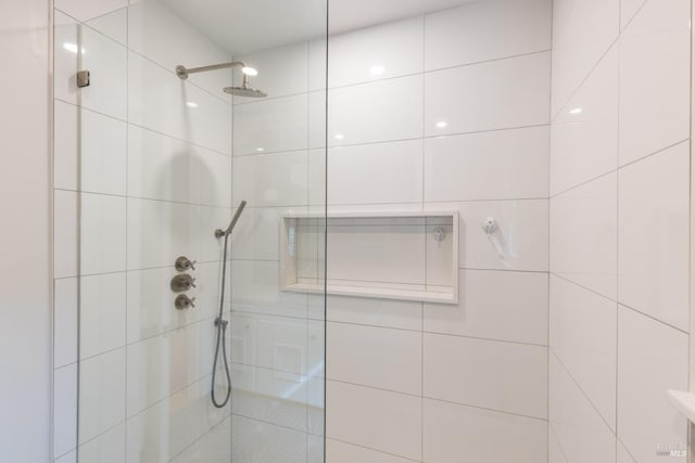 full bathroom with a tile shower