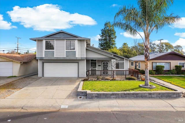 view of front of home featuring a garage and a front lawn