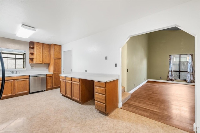 kitchen with light hardwood / wood-style floors, dishwasher, and sink