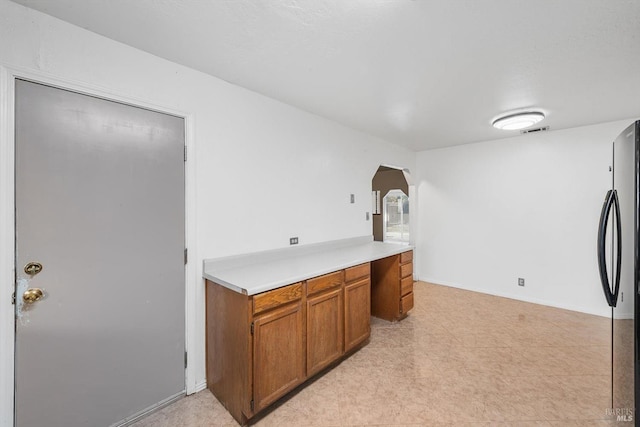 kitchen with black fridge