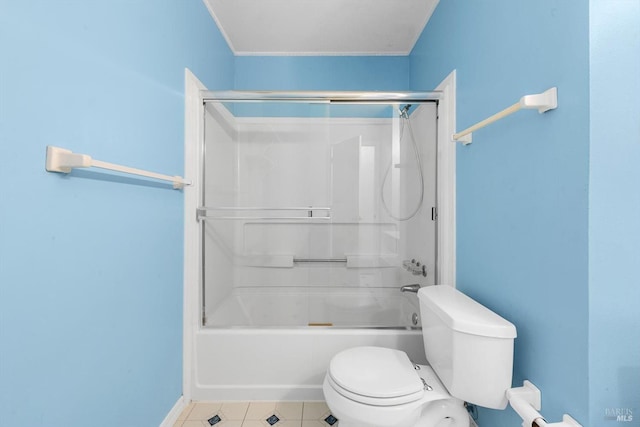 bathroom with enclosed tub / shower combo and toilet