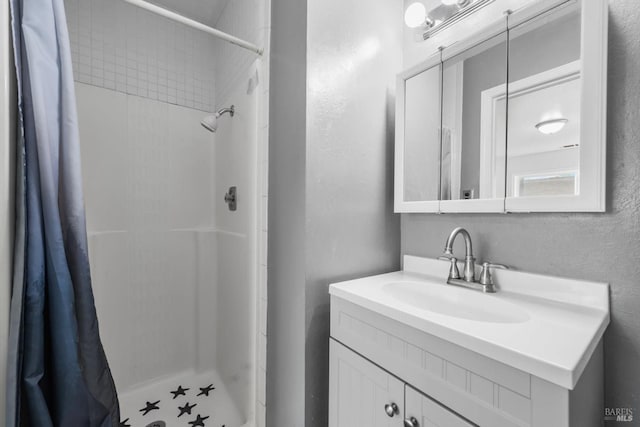 bathroom with vanity and a shower with shower curtain