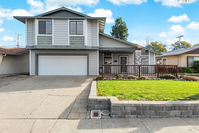 view of front facade featuring a garage, covered porch, and a front lawn