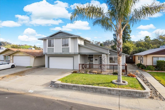 view of front of property featuring a garage and a front lawn