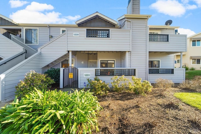 view of front of house featuring a chimney