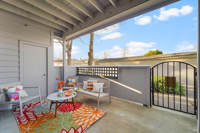 view of patio featuring a gate