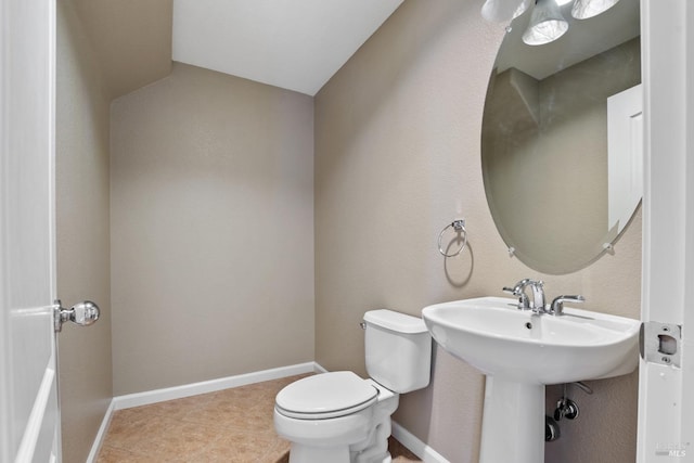 bathroom featuring tile patterned floors and toilet