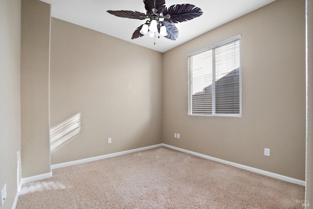 carpeted empty room with ceiling fan