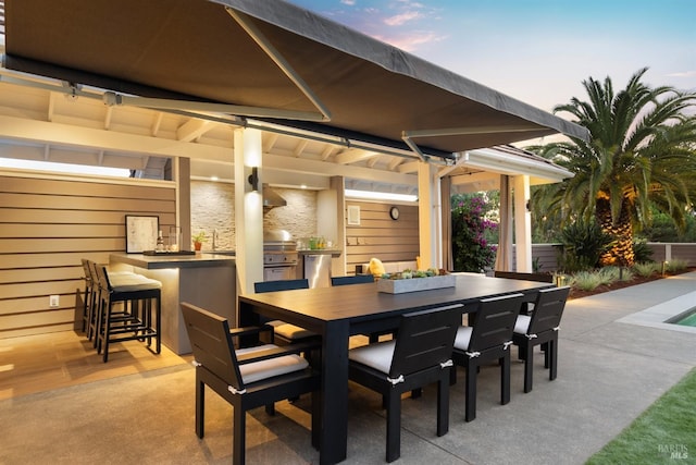 view of patio featuring an outdoor kitchen and outdoor wet bar