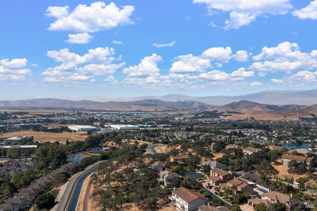 birds eye view of property with a mountain view