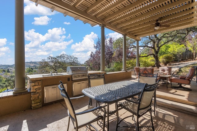 view of patio / terrace with ceiling fan, area for grilling, a pergola, and sink