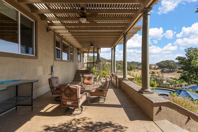 view of patio with a jacuzzi and a pergola