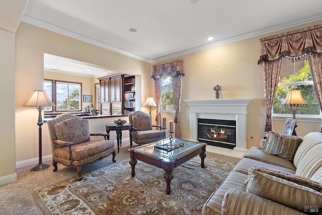 living room with crown molding, a healthy amount of sunlight, and carpet floors