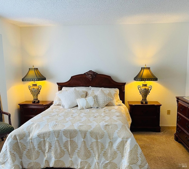 bedroom with carpet floors and a textured ceiling