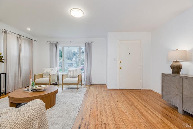 sitting room featuring light hardwood / wood-style floors