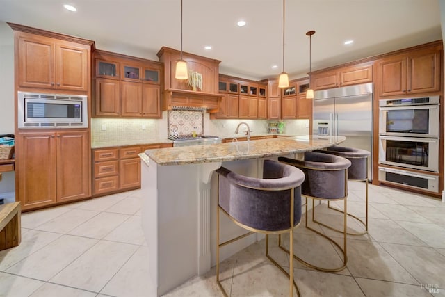 5319 Bayridge Ct, Fairfield, CA 94534 - kitchen featuring built in appliances, a warming drawer, brown cabinets, and recessed lighting