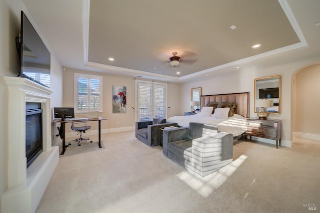 5319 Bayridge Ct, Fairfield, CA 94534 - bedroom with a tray ceiling, light carpet, a glass covered fireplace, arched walkways, and recessed lighting