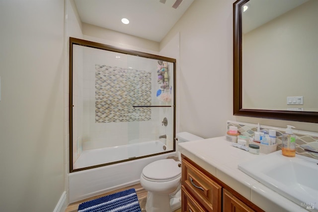 5319 Bayridge Ct, Fairfield, CA 94534 - full bathroom featuring toilet, vanity, shower / bath combination with glass door, wood finished floors, and recessed lighting