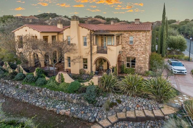 5319 Bayridge Ct, Fairfield, CA 94534 - mediterranean / spanish-style house with a balcony, a chimney, a tile roof, and stucco siding