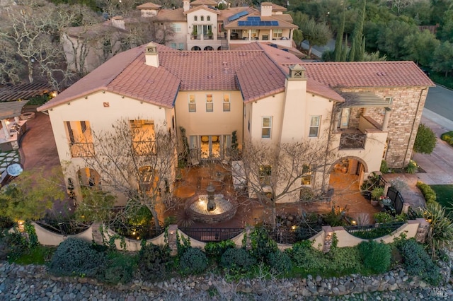 5319 Bayridge Ct, Fairfield, CA 94534 - rear view of house featuring stucco siding, a tiled roof, and a balcony