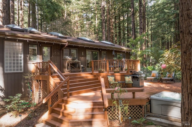 rear view of property featuring a wooden deck