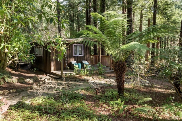 view of yard with a wooden deck