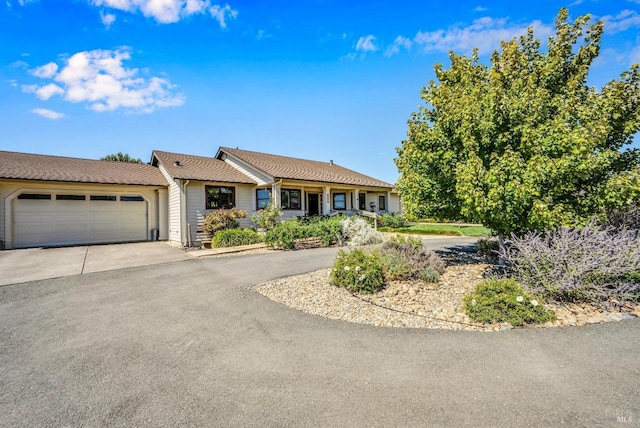 ranch-style house featuring a garage