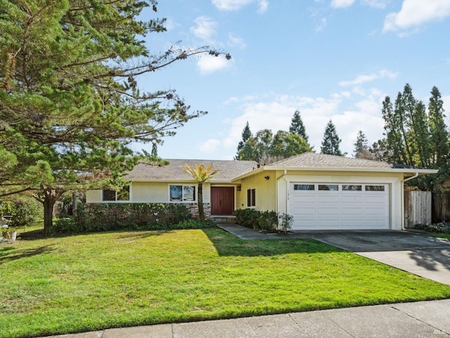 single story home with concrete driveway, a front lawn, an attached garage, and stucco siding