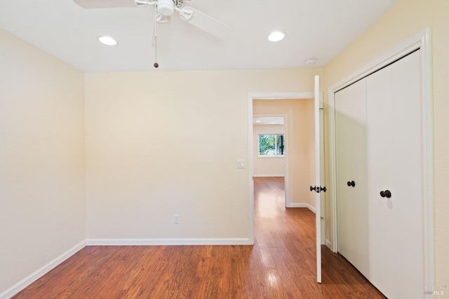 interior space featuring recessed lighting, a closet, baseboards, and wood finished floors