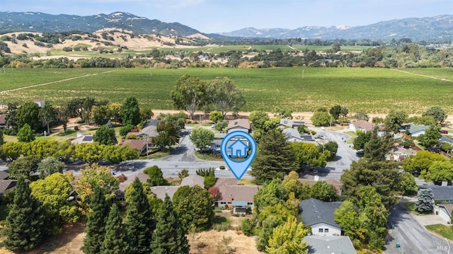 birds eye view of property with a mountain view