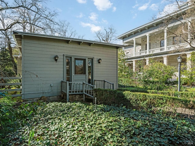 view of front of home featuring fence