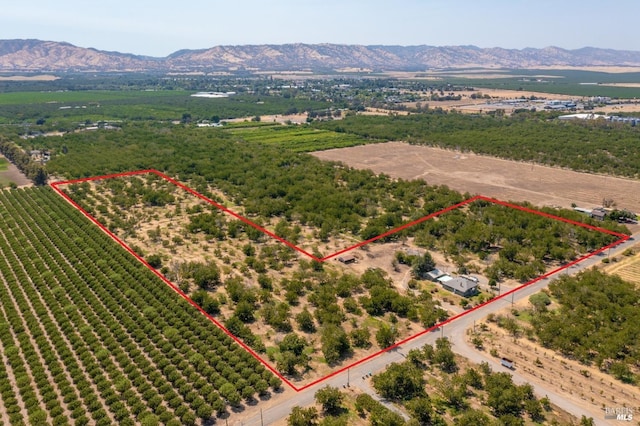 9211 Boyce Rd, Winters, CA 95694 - overview of rural landscape with property parcel outlined and a mountain backdrop