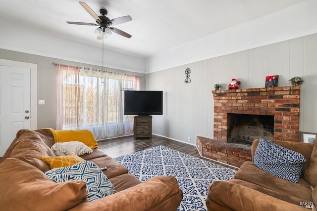 living room featuring a brick fireplace, ceiling fan, and wood-type flooring