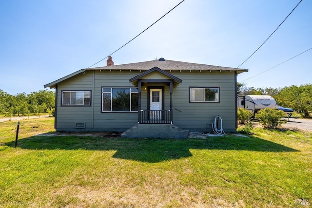 bungalow with a front lawn