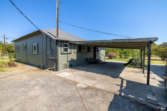 view of front of property featuring a carport