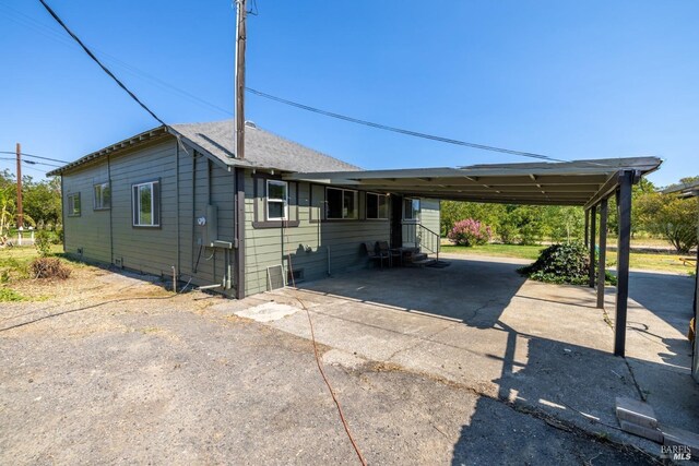 9211 Boyce Rd, Winters, CA 95694 - view of side of property featuring asphalt driveway and entry steps