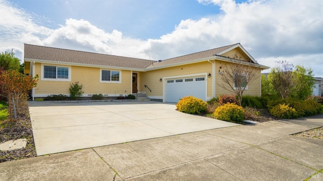 ranch-style home featuring a garage