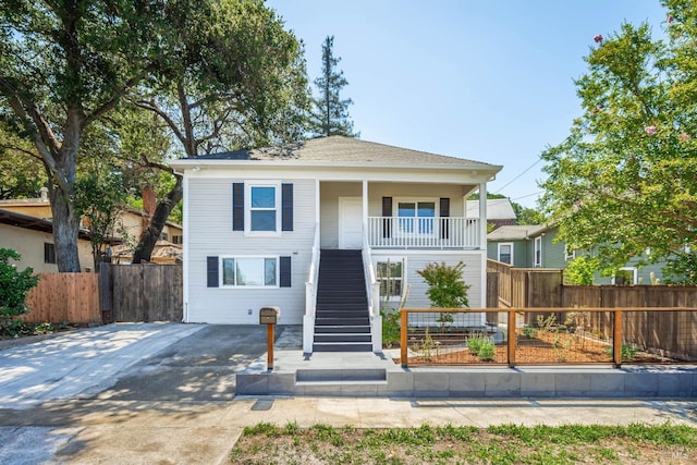 1008 Evans Ave, Napa, CA 94559 - view of front of house featuring fence, a porch, stairway, and roof with shingles