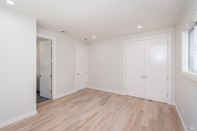 1008 Evans Ave, Napa, CA 94559 - unfurnished bedroom with a closet, visible vents, light wood finished floors, baseboards, and recessed lighting