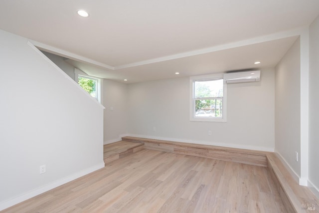 1008 Evans Ave, Napa, CA 94559 - empty room featuring a wall mounted air conditioner, baseboards, light wood-style flooring, and recessed lighting