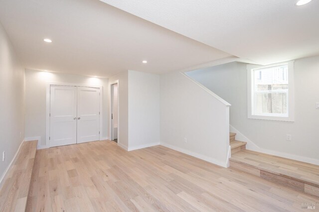 1008 Evans Ave, Napa, CA 94559 - basement featuring recessed lighting, baseboards, stairs, and light wood-type flooring