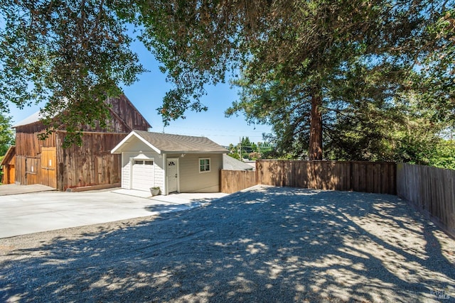 1008 Evans Ave, Napa, CA 94559 - view of property exterior with concrete driveway, a garage, and fence