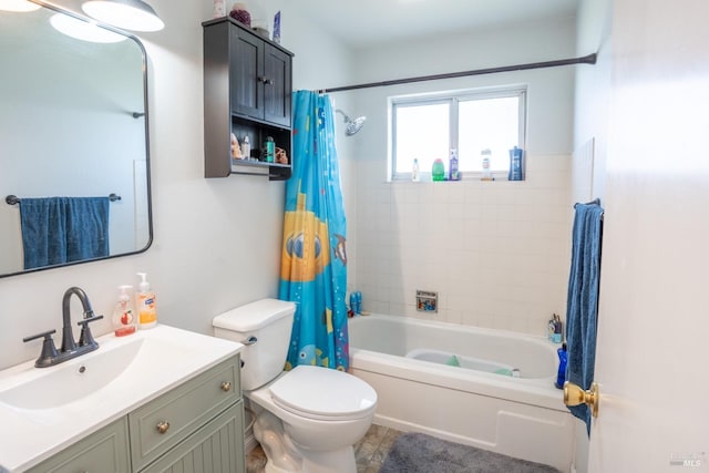 bathroom featuring vanity, shower / bath combination with curtain, and toilet