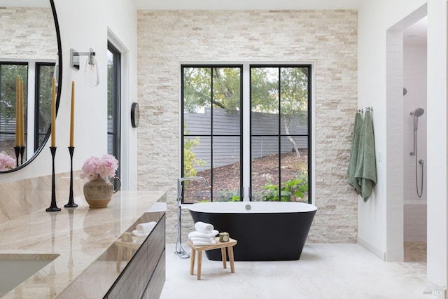 full bathroom with a freestanding tub