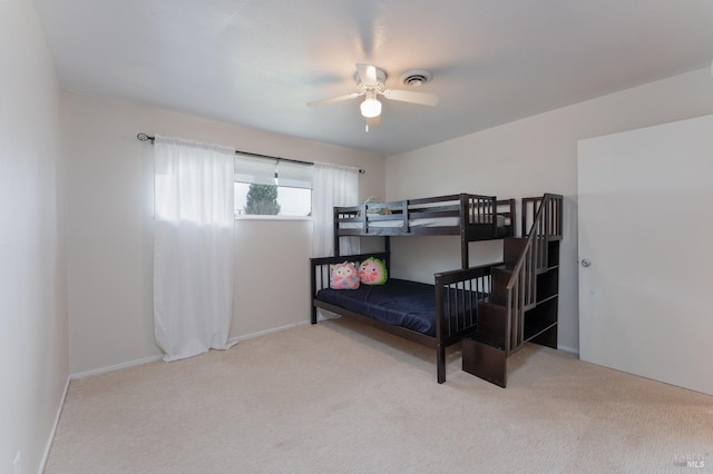 bedroom featuring carpet, visible vents, and a ceiling fan